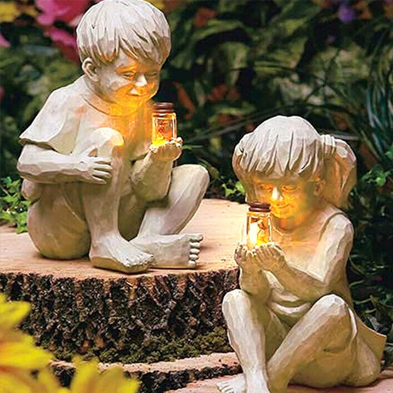 Solar resin boy and girl garden ornaments sculpture