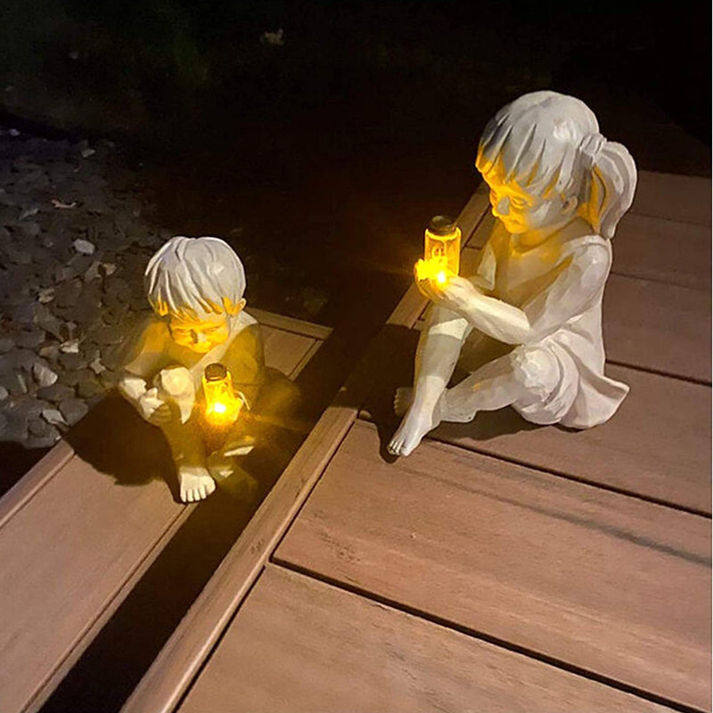 Solar resin boy and girl garden ornaments sculpture