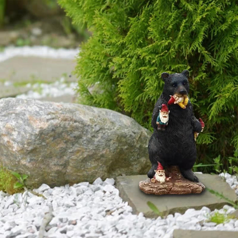 Black bear eating elf desktop ornament