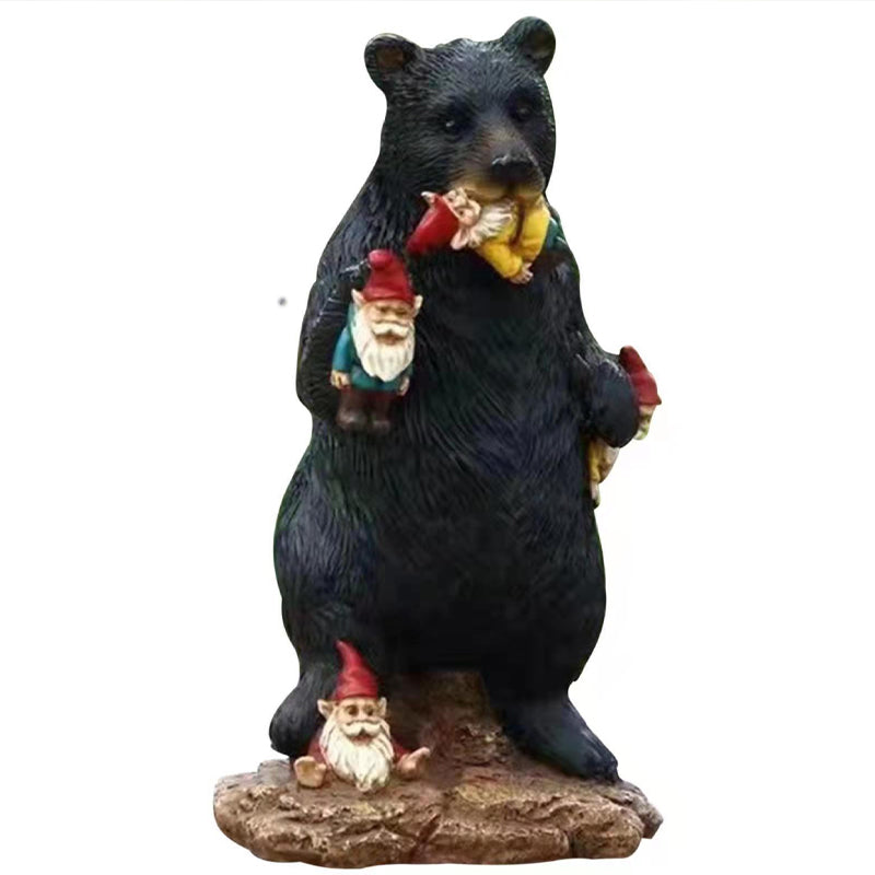 Black bear eating elf desktop ornament