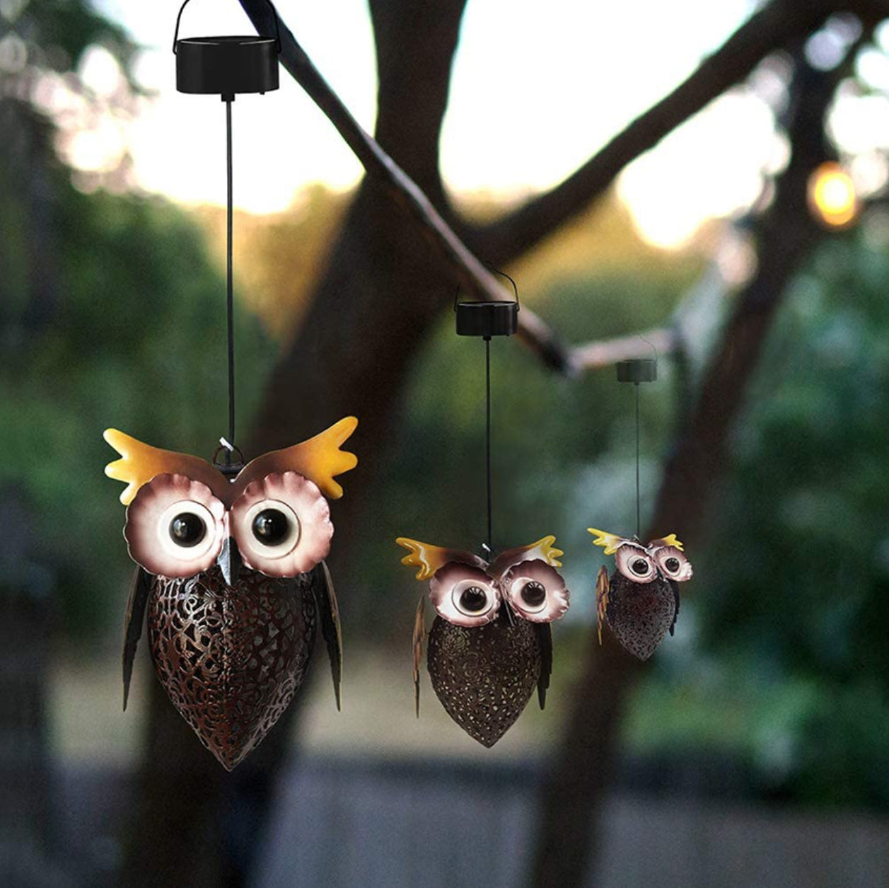 A owl shaped garden solar light with iron hollow pendant light